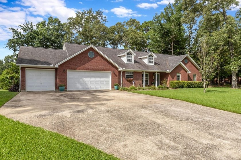 Experience luxury lakeside living in this custom built brick - photo 3