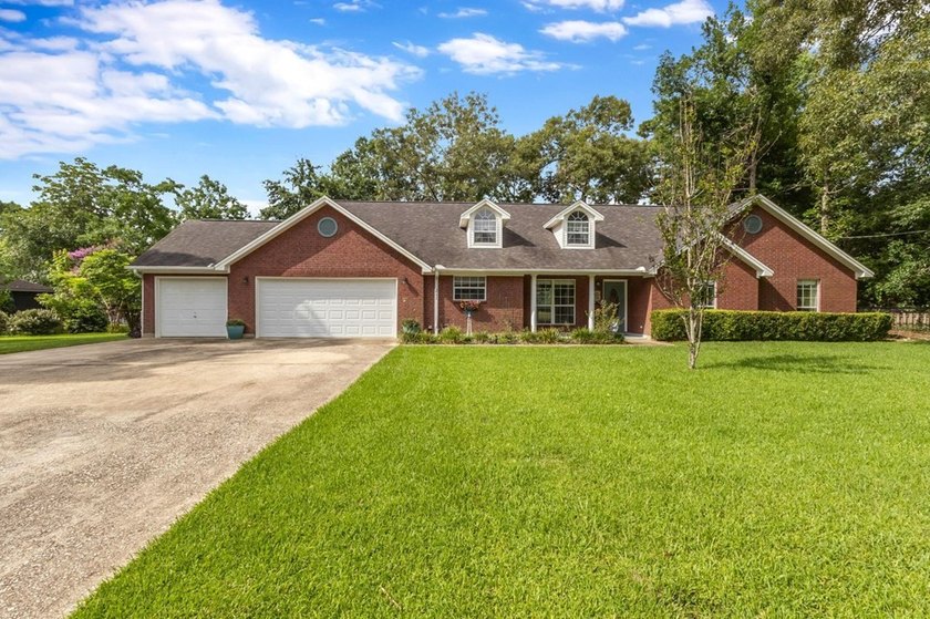 Experience luxury lakeside living in this custom built brick - photo 4
