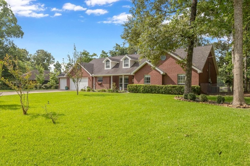 Experience luxury lakeside living in this custom built brick - photo 5
