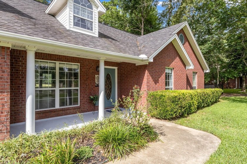 Experience luxury lakeside living in this custom built brick - photo 7
