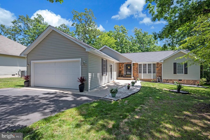 Welcome to 124 Republic Avenue in Lake of the Woods. Discover - photo 3