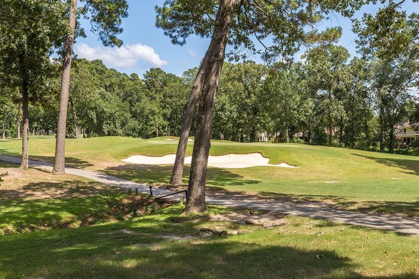 Nestled on a picturesque golf course lot, this exceptional - photo 5