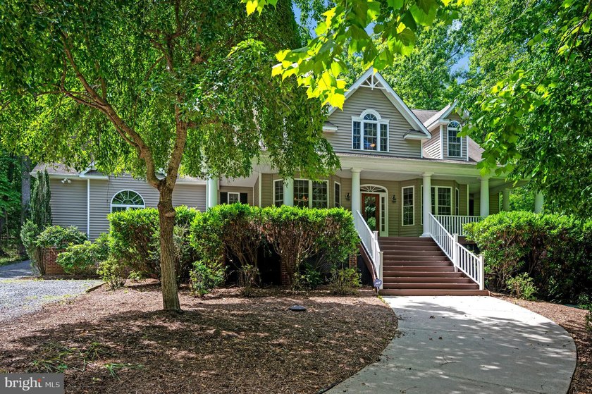 Imagine starting your day on the expansive covered front porch - photo 4