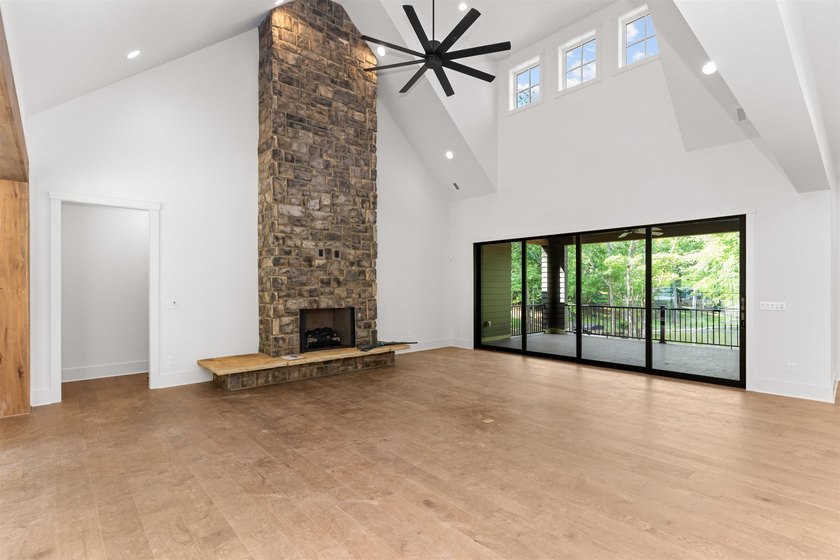 The Hearth is a waterfront home designed around the moments that - photo 15