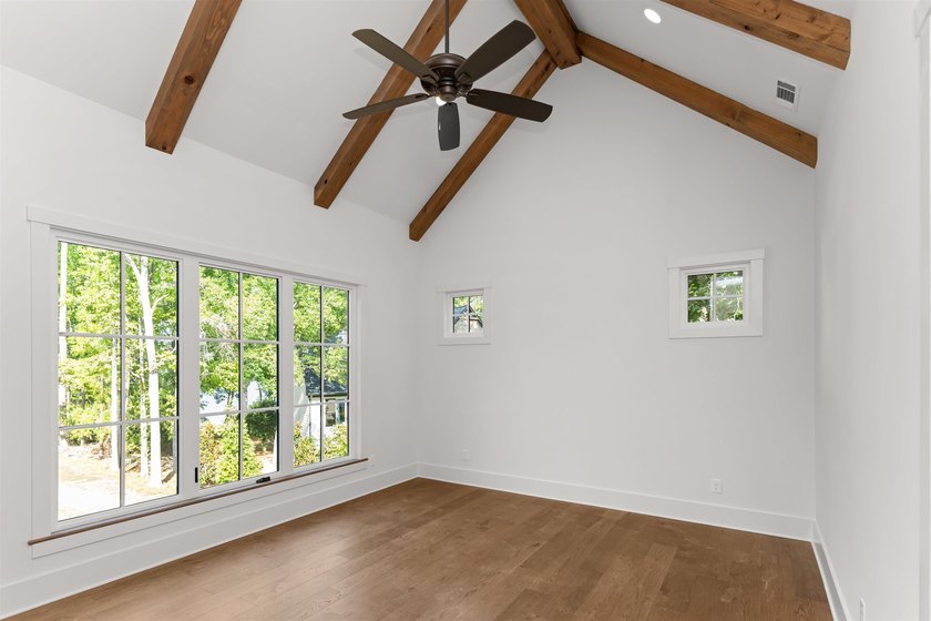 The Hearth is a waterfront home designed around the moments that - photo 20