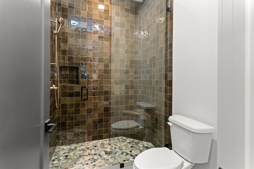 The Hearth is a waterfront home designed around the moments that - photo 41