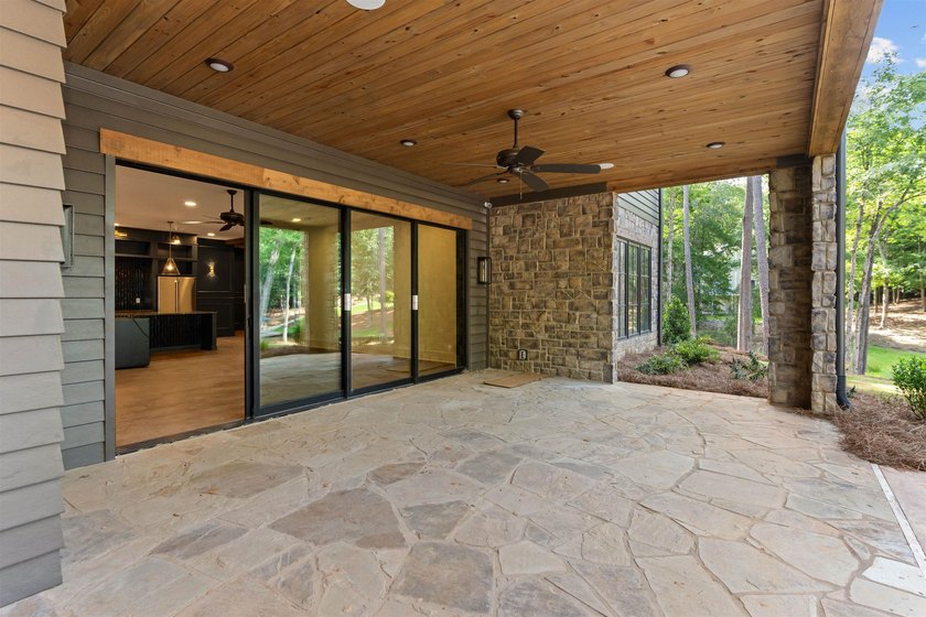 The Hearth is a waterfront home designed around the moments that - photo 43