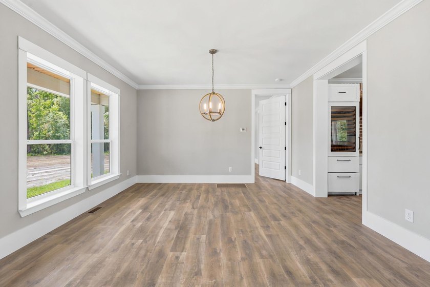 Welcome to 670 Kent Road, where a beautiful gated brick entrance - photo 8