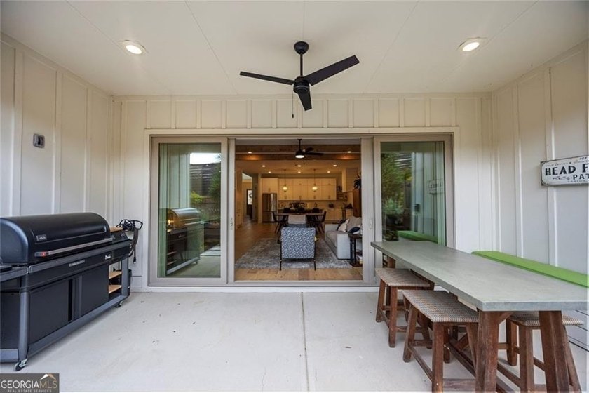 Tucked in the heart of Bridgemill, this luxury townhome lives - photo 10
