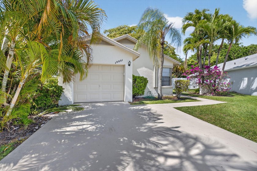 This beautifully renovated 3-bedroom, 2-bath home is tucked away - photo 2