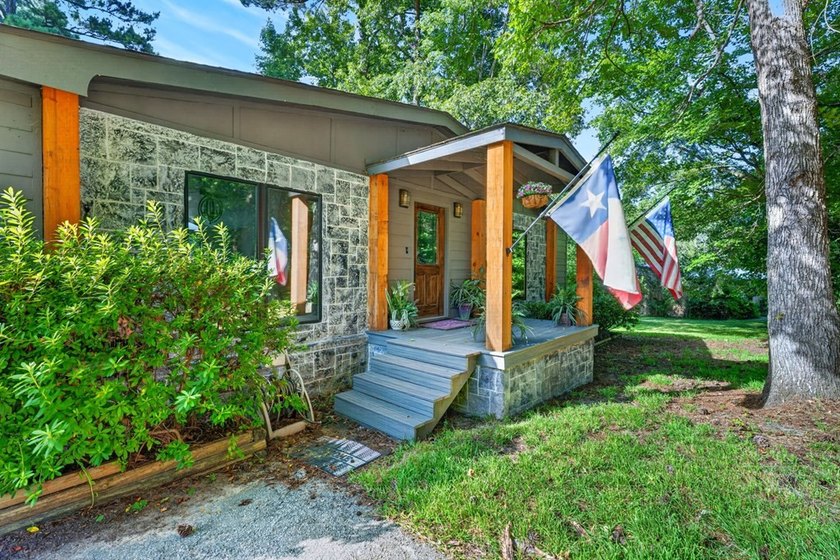 Discover the beauty of waterfront living on Lake Pinkston in - photo 3