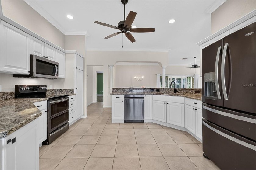 Nestled on a LARGE CORNER LOT in the highly coveted village of - photo 7