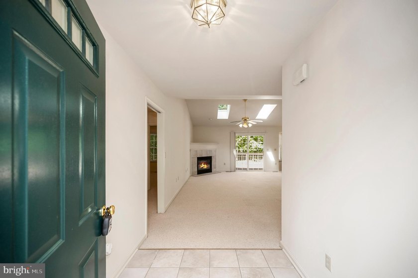 Nestled among mature green trees in the gated Lake of the Woods - photo 6