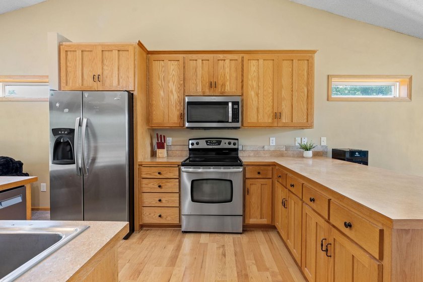 Bright, open, and overlooking the pond, this home offers a - photo 12