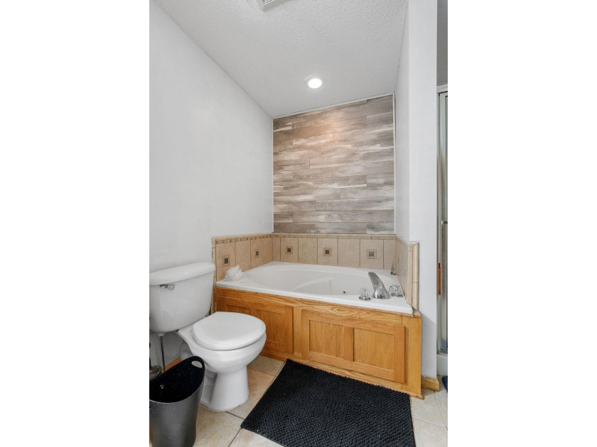 Bright, open, and overlooking the pond, this home offers a - photo 29