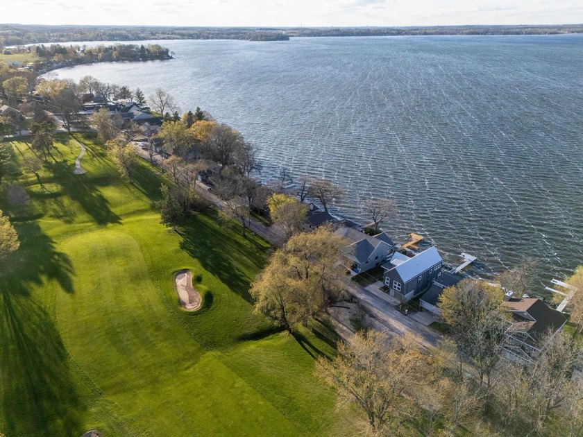 Lakefront luxury meets architectural distinction in this - photo 14