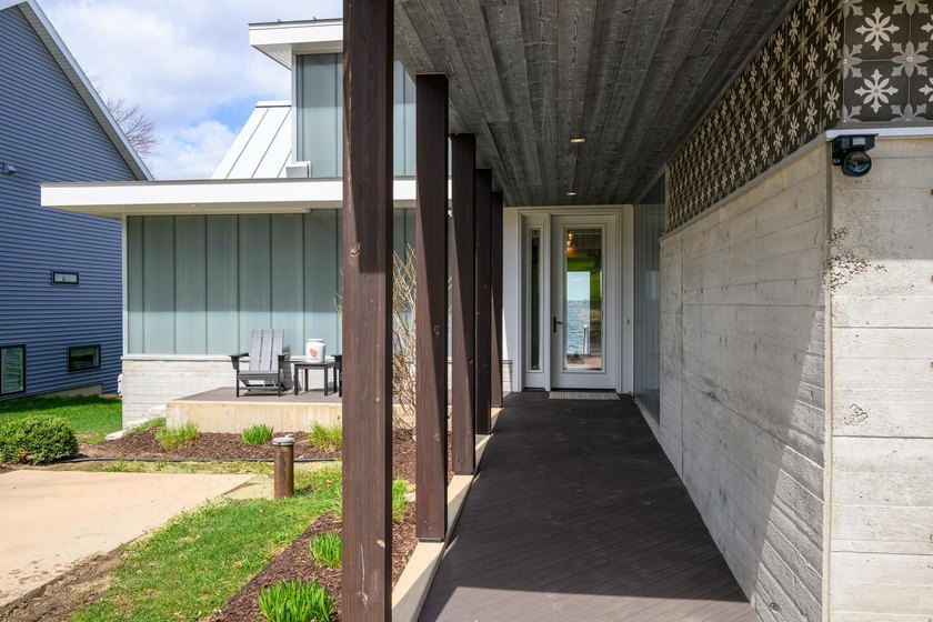 Lakefront luxury meets architectural distinction in this - photo 16