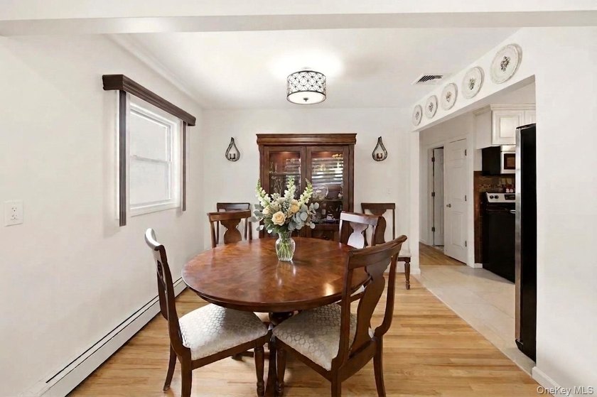 Refined comfort meets effortless Long Island living in this - photo 7