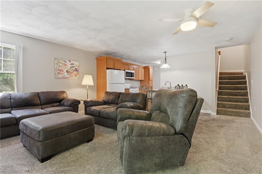Welcome to this well-maintained 2-bedroom, 1.5-bath condominium - photo 3