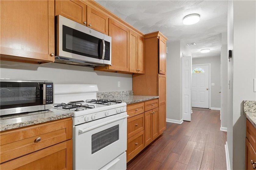 Welcome to this well-maintained 2-bedroom, 1.5-bath condominium - photo 9