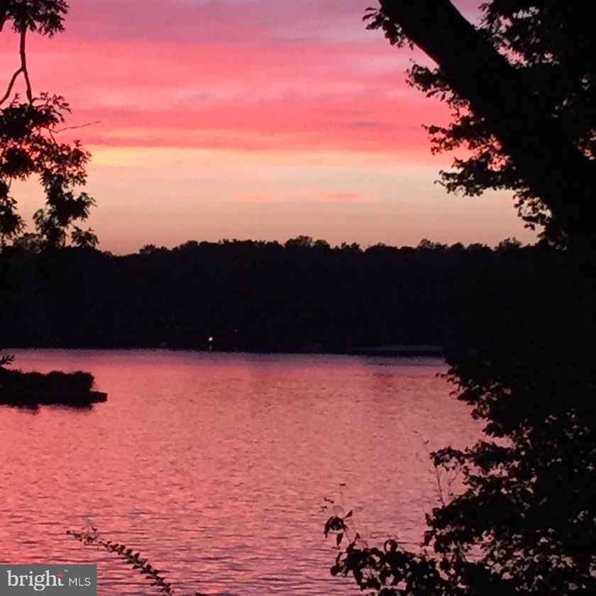 Nestled in a peaceful cove with stunning main lake views and - photo 8