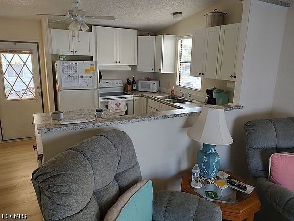 Welcome to this charming and newly refreshed home located in the - photo 3
