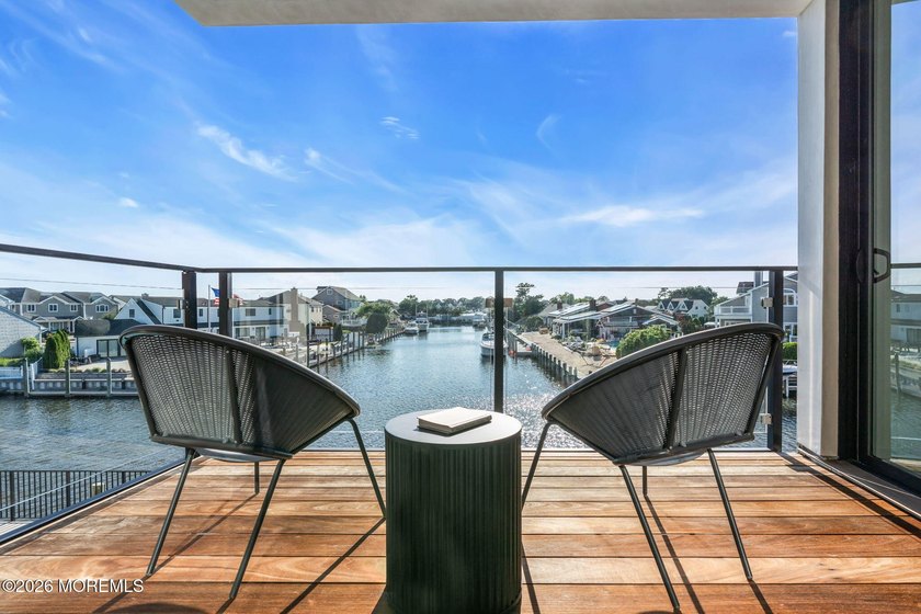 A rare modern waterfront retreat, this architect-designed home - photo 11