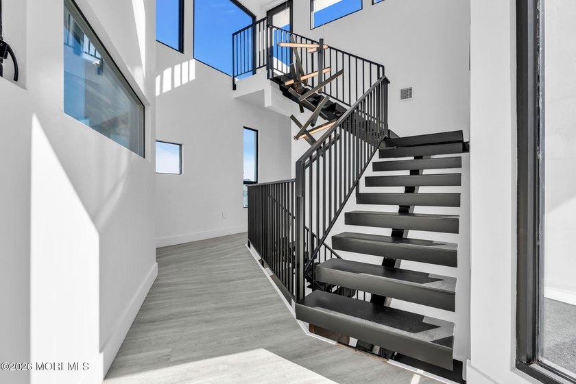 A rare modern waterfront retreat, this architect-designed home - photo 33
