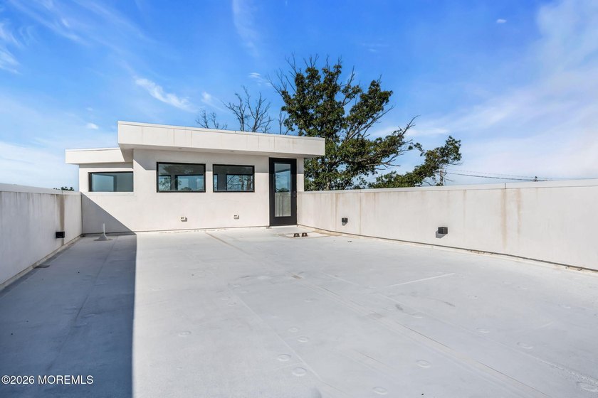 A rare modern waterfront retreat, this architect-designed home - photo 36