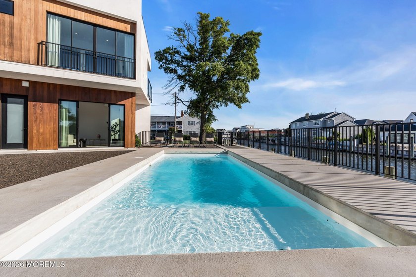 A rare modern waterfront retreat, this architect-designed home - photo 44