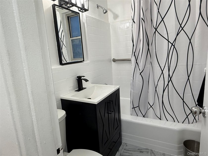 Move-right into this bright and updated top-floor 1-bedroom, 1 - photo 9