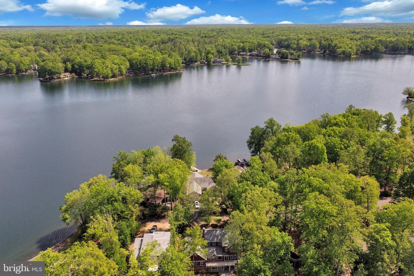 Discover this stunning raised ranch home nestled in the - photo 5