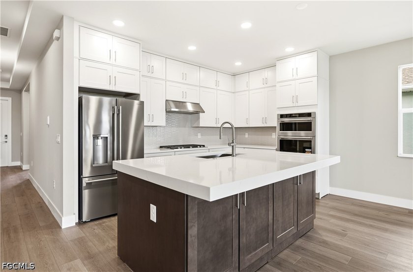 Enjoy a free golf cart with home purchase! This exceptional - photo 3