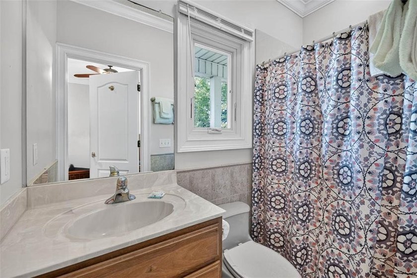 Classic coastal charm meets an unbeatable location in this - photo 26