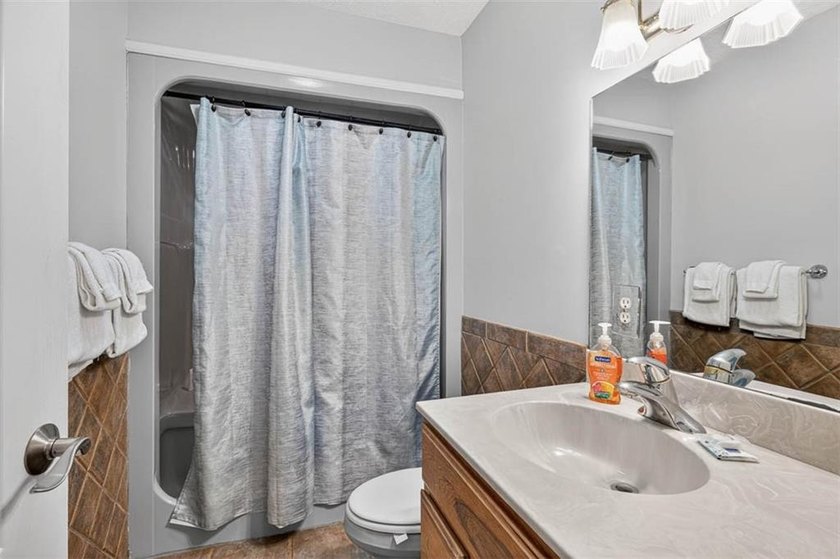 Classic coastal charm meets an unbeatable location in this - photo 29