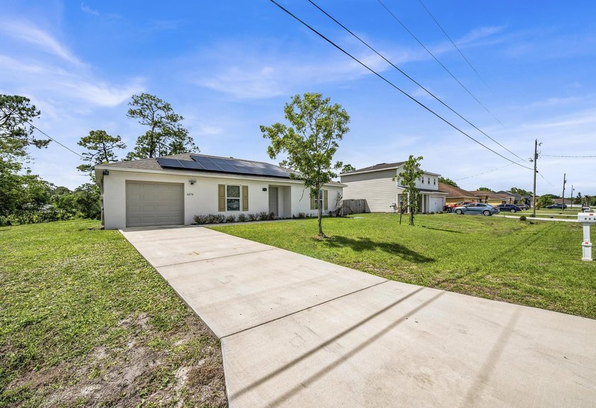 Welcome to this beautifully maintained 2023 built home located - photo 3