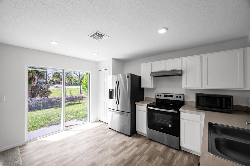 Welcome to this beautifully maintained 2023 built home located - photo 7