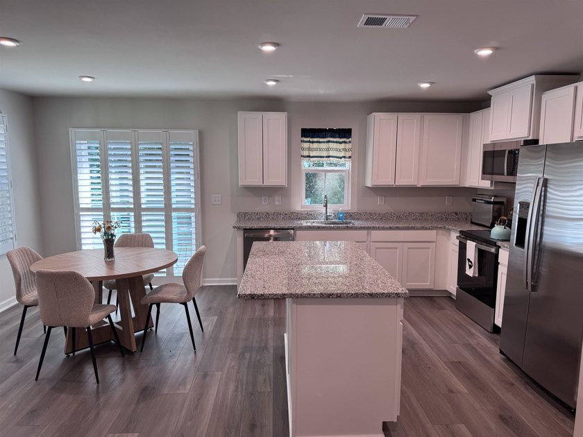 Welcome home to this never-before-lived-in end unit 3-bedroom, 2 - photo 5