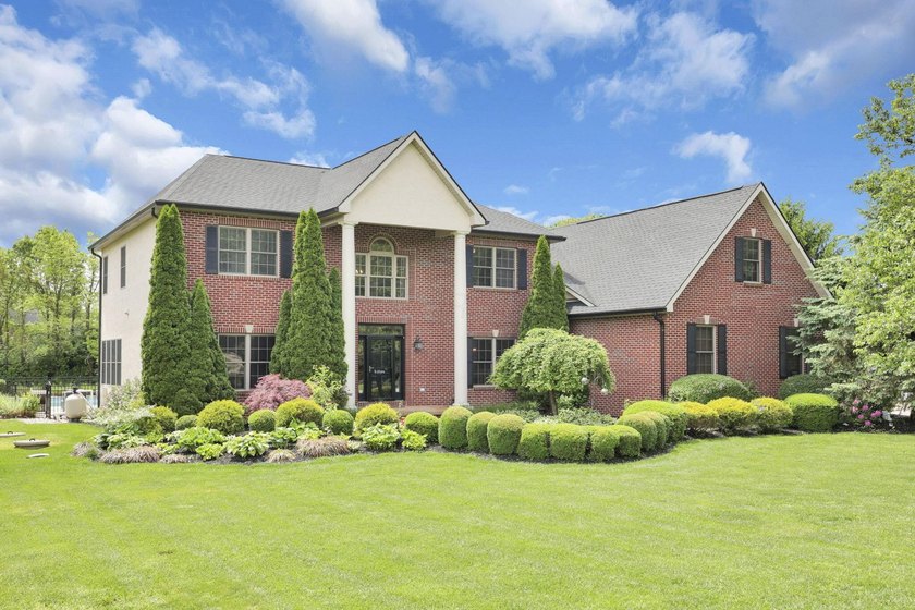 1.35-acre estate,framed by a dense, private wall of mature trees - photo 2