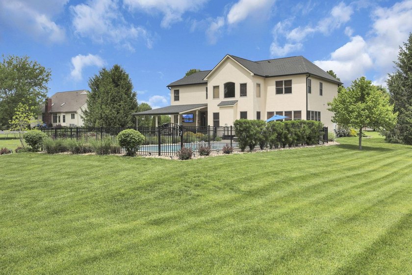 1.35-acre estate,framed by a dense, private wall of mature trees - photo 8