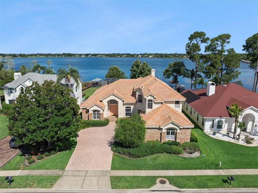 Experience exceptional lakefront living in this custom-built - photo 3
