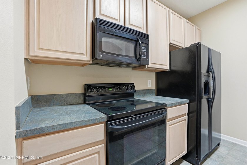 Soaring ceilings enhance the spacious layout with an open - photo 11