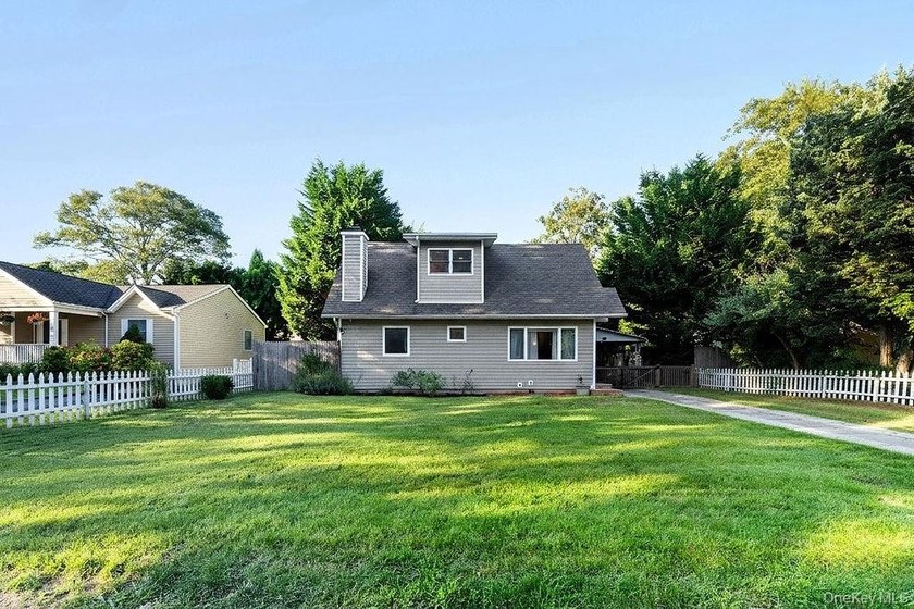 Welcome to this charming 4-bedroom, 2-bath home nestled in the - photo 3