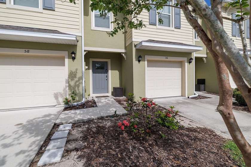 Welcome home to Bella Oaks! Incredible townhouse located in the - photo 2