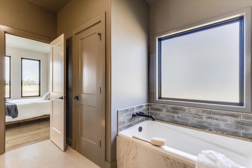 MODEL IS NOW FOR SALE! Stunning 5 Bedroom, 3 Bath Lakefront Home - photo 22