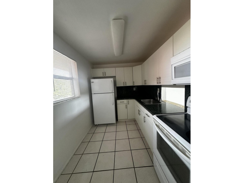 Welcome to this charming 1-bedroom, 1-bath condo offering the - photo 26
