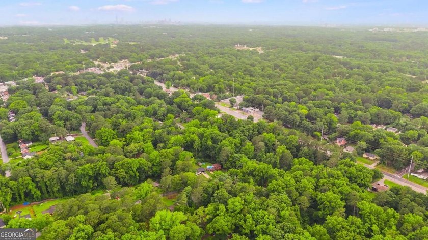 Rare 9.5-Acre Haven with Spring-Fed Pond, Multiple Structures &amp; - photo 11