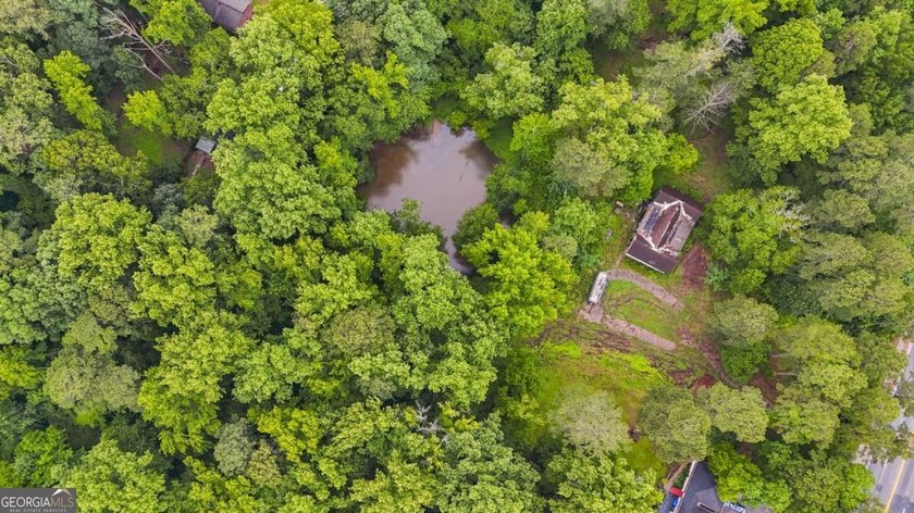 Rare 9.5-Acre Haven with Spring-Fed Pond, Multiple Structures &amp; - photo 12