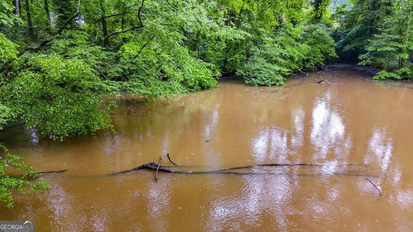 Rare 9.5-Acre Haven with Spring-Fed Pond, Multiple Structures &amp; - photo 14