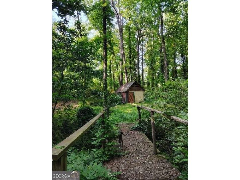 Rare 9.5-Acre Haven with Spring-Fed Pond, Multiple Structures &amp; - photo 24